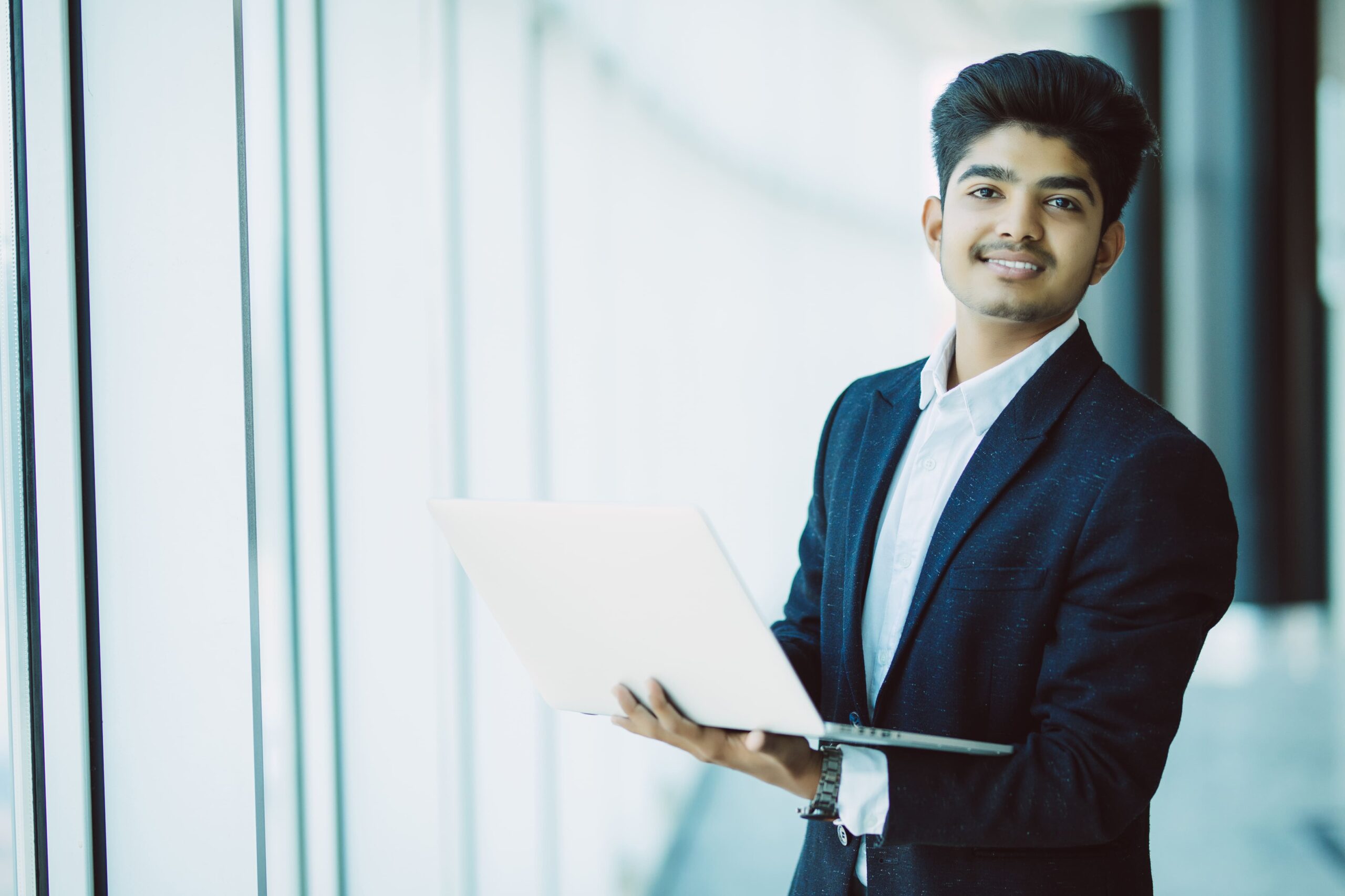 Business Development Officer working on laptop